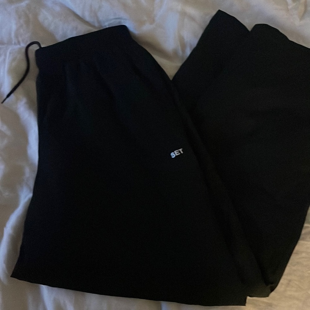 Nylon track pants.